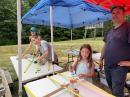 At the Albemarle Amateur Radio Club (AARC) in Earlysville, Virginia, several youth built 2-meter fox hunt antennas using tape measures at the Field Day location. Pictured are (left to right) Deanna Soika, KQ4BCP; Zeph Soika, KQ4BIM; Noelle Soika and on the far right, their father, Len Soika, KQ4BBR. [Photo courtesy of Bill Morine, N2COP, and Jim Boehner, N2ZZ]
